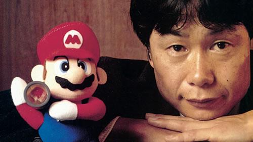 Shigeru Miyamoto with a Mario soft toy in 1995